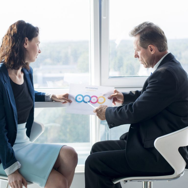 businessman-explaining-chart-his-female-colleague